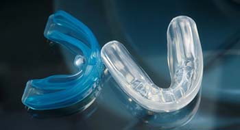 Closeup of mouthguards for preventing dental emergencies in Daytona Beach
