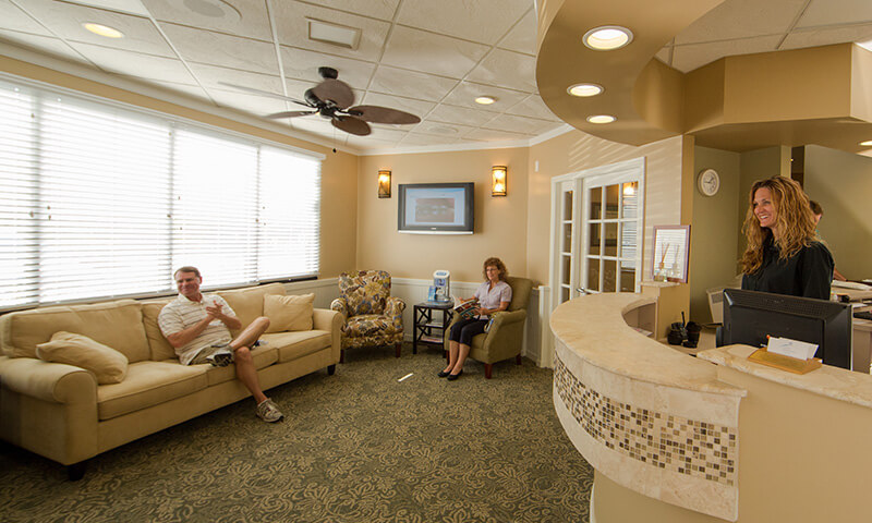 Dental patients relaxing in waiting room