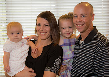 Smiling family in waiting room of Daytona Beach dental office