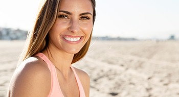 Woman smiling after completing cosmetic treatment