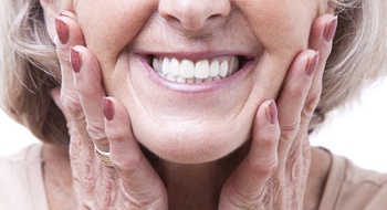 Closeup of woman smiling with dentures in Daytona Beach