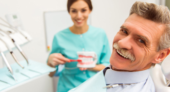 Smiling senior man at the dentist