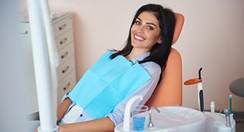 Young woman waiting in dentist’s chair