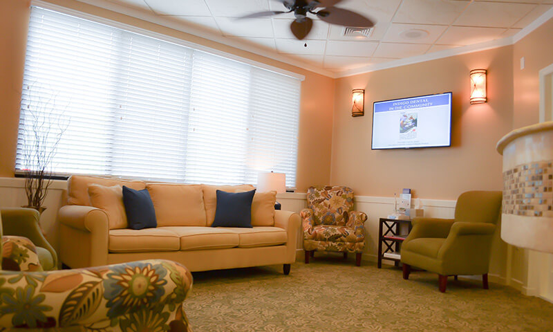 Plush chairs and sofa in dentist's office