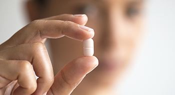 White tablet antibiotic pill