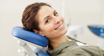 Woman in dental chair smiling