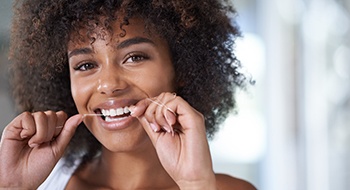 Woman flossing