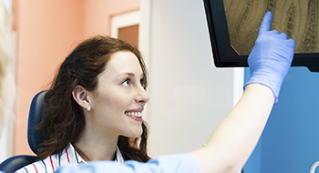 Dental patient looking at tooth x-rays