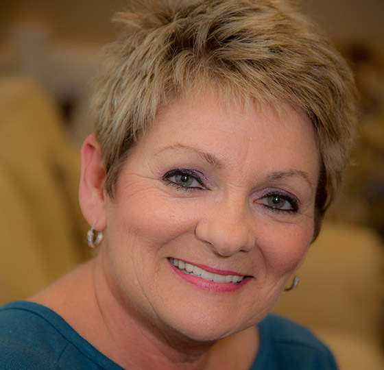 Woman with short hair smiling in Daytona Beach