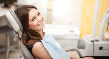 Smiling woman in dental chair