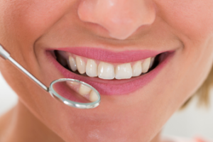 Healthy smile in dental mirror