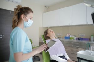 Woman at dentist in Daytona Beach amid COVID-19.