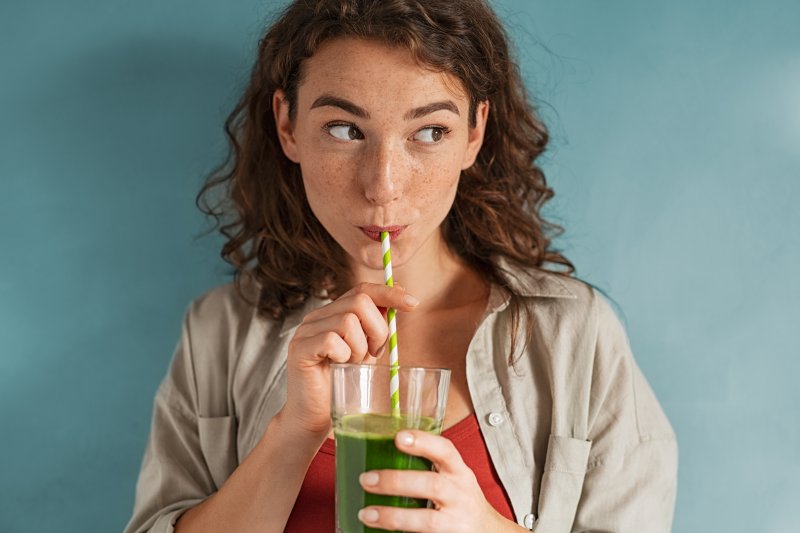 Portrait of a woman drinking a smoothie