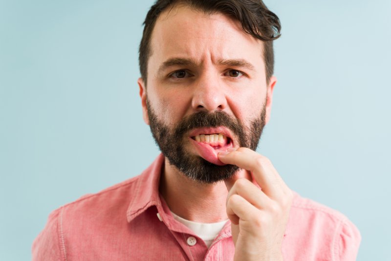 a man experiencing gum disease in Daytona Beach