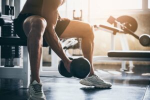 Man exercising by lifting weights