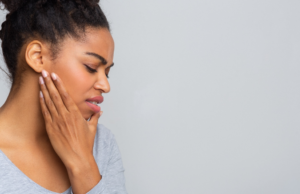 a person dealing with jaw pain